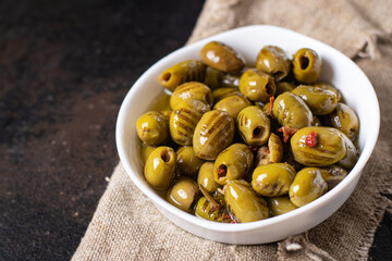 grilled olives fresh fruits in a plate ready to eat portion meal snack on the table copy space food background rustic. top view