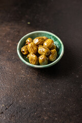 grilled olives fresh fruits in a plate ready to eat portion meal snack on the table copy space food background rustic. top view