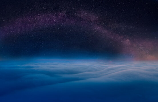 Starry sky above the clouds, mystical magical atmosphere.