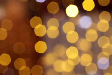 Blurred yellow and white lights on brown-gray background