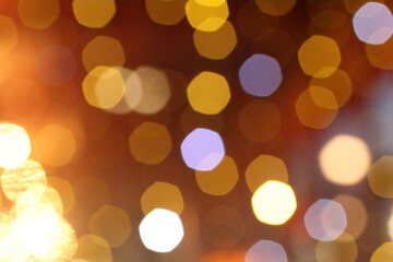 Blurred yellow and white lights on brown-gray background