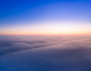The sky above the clouds before dawn.