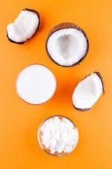 Vegan coconut milk in powder and dissolved with water in a glass, vertical, top view
