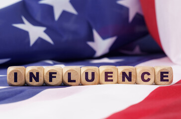 The US flag has cubes with the inscription - INFLUENCE