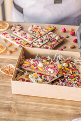 Obraz na płótnie Canvas chocolate decorated with nuts, freeze-dried berries