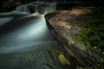 Ethereal water scenics of rivers and streams with a long exposure.  Light trickles in to expose the...