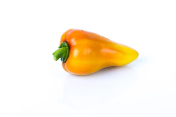 Raw bell pepper on the white glossy background