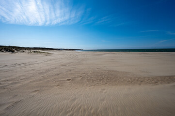 Fototapeta na wymiar View on wide white sandy North sea beach in Renesse, Zeeland, Netherlands