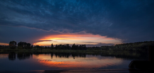 Bright color sunset reflected in the water.