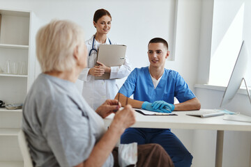 elderly woman at the hospital at the doctor's appointment nurse assistant diagnostics