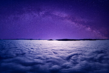Starry sky above the clouds, mystical magical atmosphere.
