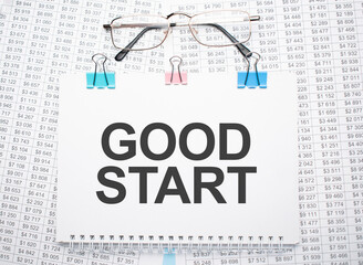 good start text written on paper with pen and glasses