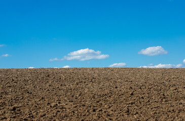 a field ready for sowing and blue sky
