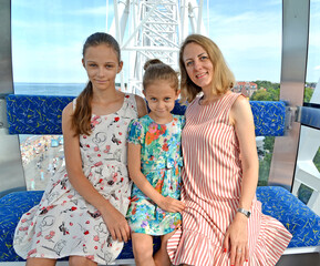 The family is riding a Ferris wheel. Zelenogradsk, Kaliningrad region