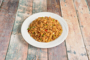 Great portion of Thai fried rice with sautéed vegetables, pieces of prawns and soy sauce