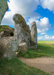 the beautiful aged stone of neolithic chambered tombs at West Kennet Long Barrow, part of the...