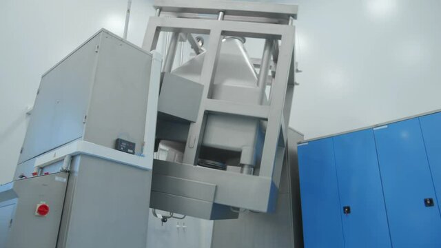 Process of production of pills, tablets. Industrial pharmaceutical concept. Factory equipment and machine. Steel