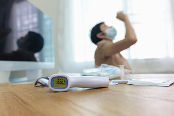 Close-up infrared forehead thermometer gun after check body temperature for virus covid-19 symptoms...