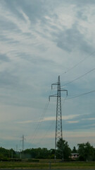 Fototapeta na wymiar Power line pole, electrical Pylon, blue sky, clouds