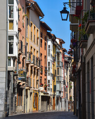 Obraz premium Vitoria-Gasteiz, Spain - 20 August 2021: Colorful buildings in the narrow streets of old town Vitoria Gasteiz