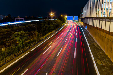 Fototapeta na wymiar traffic on highway at night with light trails, Autobahn in Berlin at night with light trails