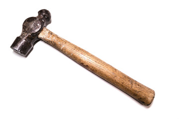 An old hammer with a wooden handle on a white background