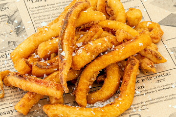 Squid squid battered in wheat flour and fried in olive oil with sea salt flakes