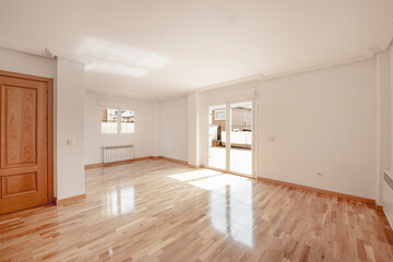 Fototapeta na wymiar Empty living room of brand new detached house with parquet floors
