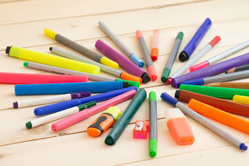 colored crayons on wooden table