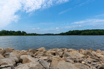 Gorgeous sunny summer day at Freeman Lake in Elizabethtown, KY.  Composed with rocks in the...