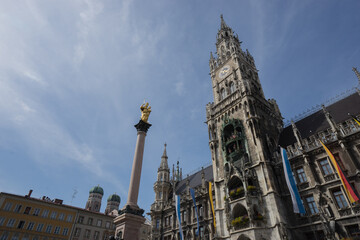 Munich, Bavaria, Germany - August 13, 2021: cityscape at the "Marienplatz" while Covid19 pandemic, view to the city hall with the "Glockenspiel", in the background the Church of our Lady