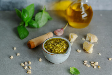 Pesto sauce in small bowl on table