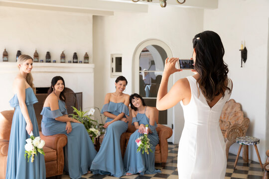 Bride and Bridesmaids taking pictures
