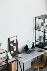 High angle view at minimal home office workplace with laptop and accessories in black and white, copy space