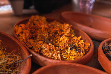 clay pot with yellow flower to make natural pigment in fabric factory