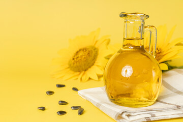 Sunflower oil, seeds and flower isolated on white background.