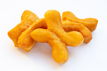 Deep-fried dough sticks or chinese bread sticks on white background.