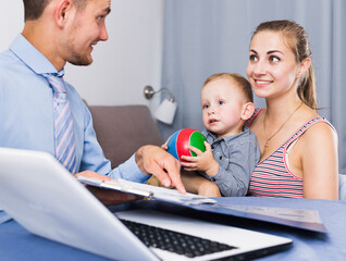 Manager of network marketing company with documents with female