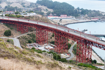 Aerial view over road of Golden Gate bridge connecting to the land.