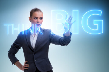 Think big concept with businesswoman
