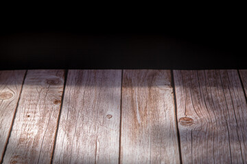 Wooden plate with black background. 
