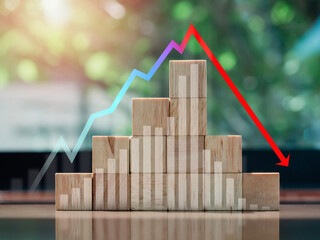 Crisis chart and graph. Economic downturn with Increase and decrease arrow on the top of wooden blocks steps on desk, eco style. The business volatility trend process, finance, and economic concept.
