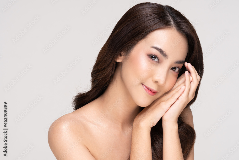 Wall mural Beautiful Asian woman looking at camera smile with clean and fresh skin Happiness and cheerful with positive emotional,isolated on white background,Beauty and Cosmetics Concept