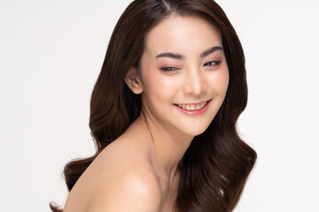 Fototapeta premium Beautiful Asian woman looking at camera smile with clean and fresh skin Happiness and cheerful with positive emotional,isolated on white background,Beauty and Cosmetics Concept