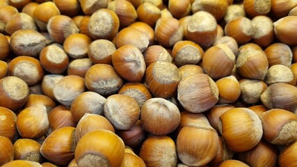 unpeeled hazelnuts. background and texture. agriculture. supermarket
