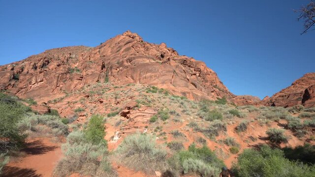 St George Hiking Trail, Utah USA, Slow Motion of Young Female Hiker Under Red Sandstone Hills on Hot Sunny Day, Full Frame