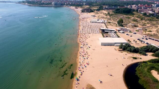 4K moving forward drone clip over an exotic golden sand beach in Sunny Beach, Bulgaria