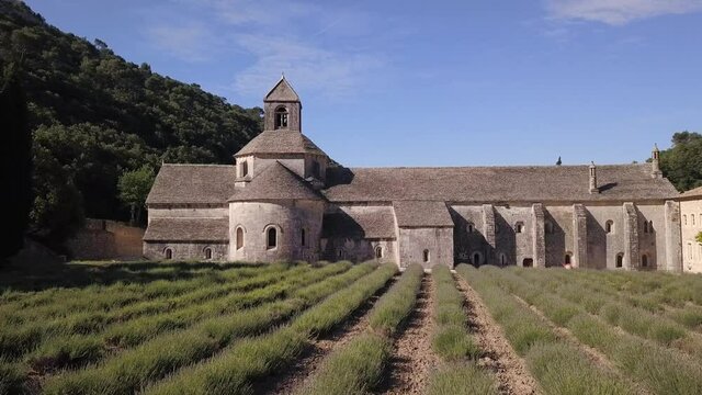 Aerial view of a lavanda fields in front of the Abbaye of S&eacute;nanque on a sunny day