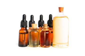 various amber glass bottles for cosmetics, natural medicine , essential oils or other liquids isolated on a white background 