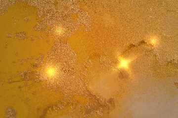 Luxury abstract fluid art alcohol ink pattern with marble texture. Modern yellow and gold background with paint splash and golden glitter for poster, flyer, brochure design.